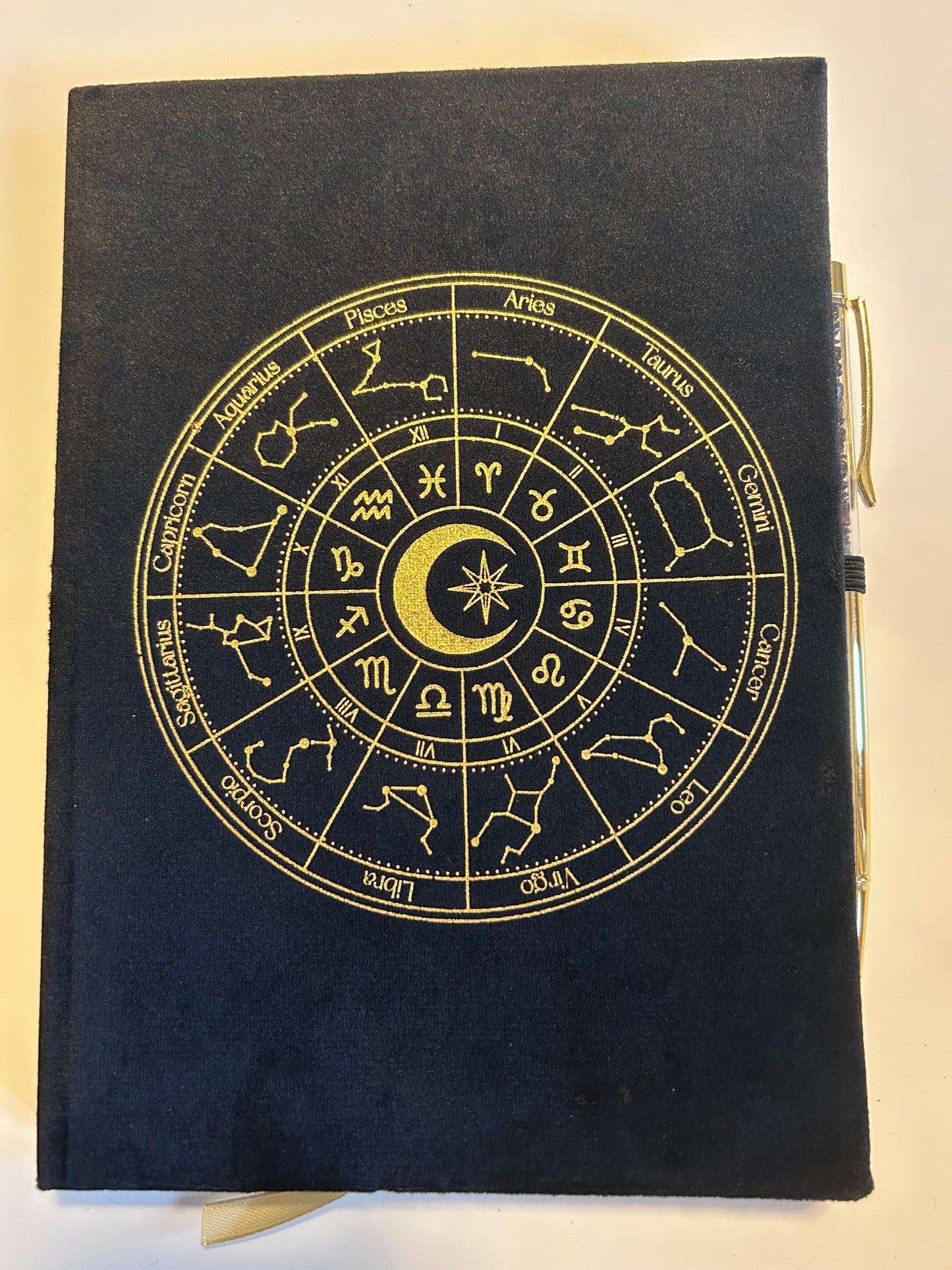 Skrivbok astrologihjul med penna